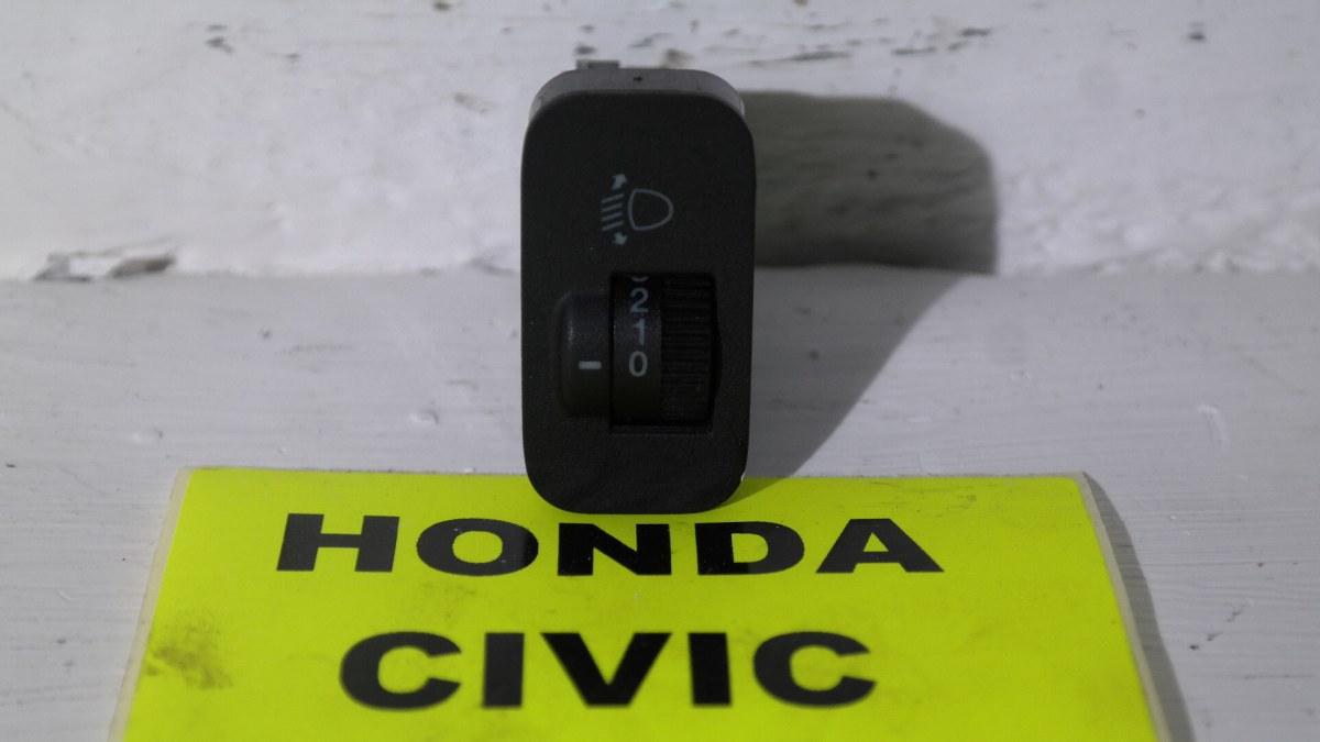 Honda civic dal 2002 al 2006 pulsante regolaggio fari